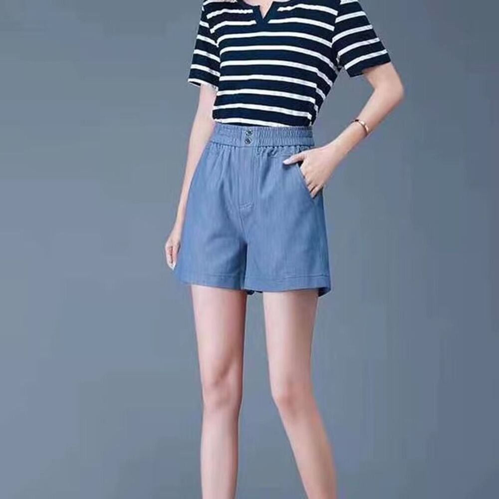 Blue cotton denim shorts with elastic waist and pockets.